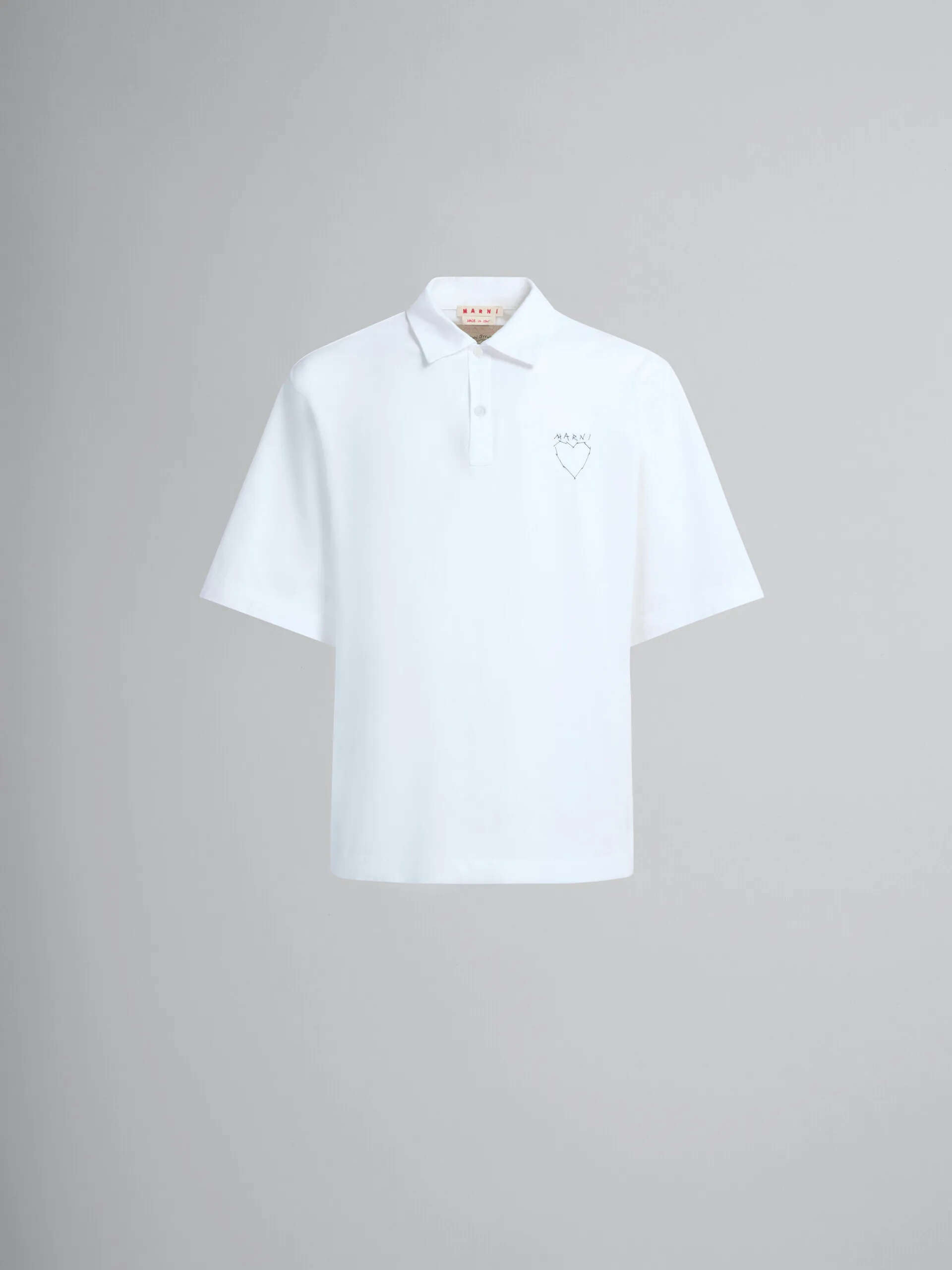 Polo de algodón orgánico blanco con estampado en la espalda